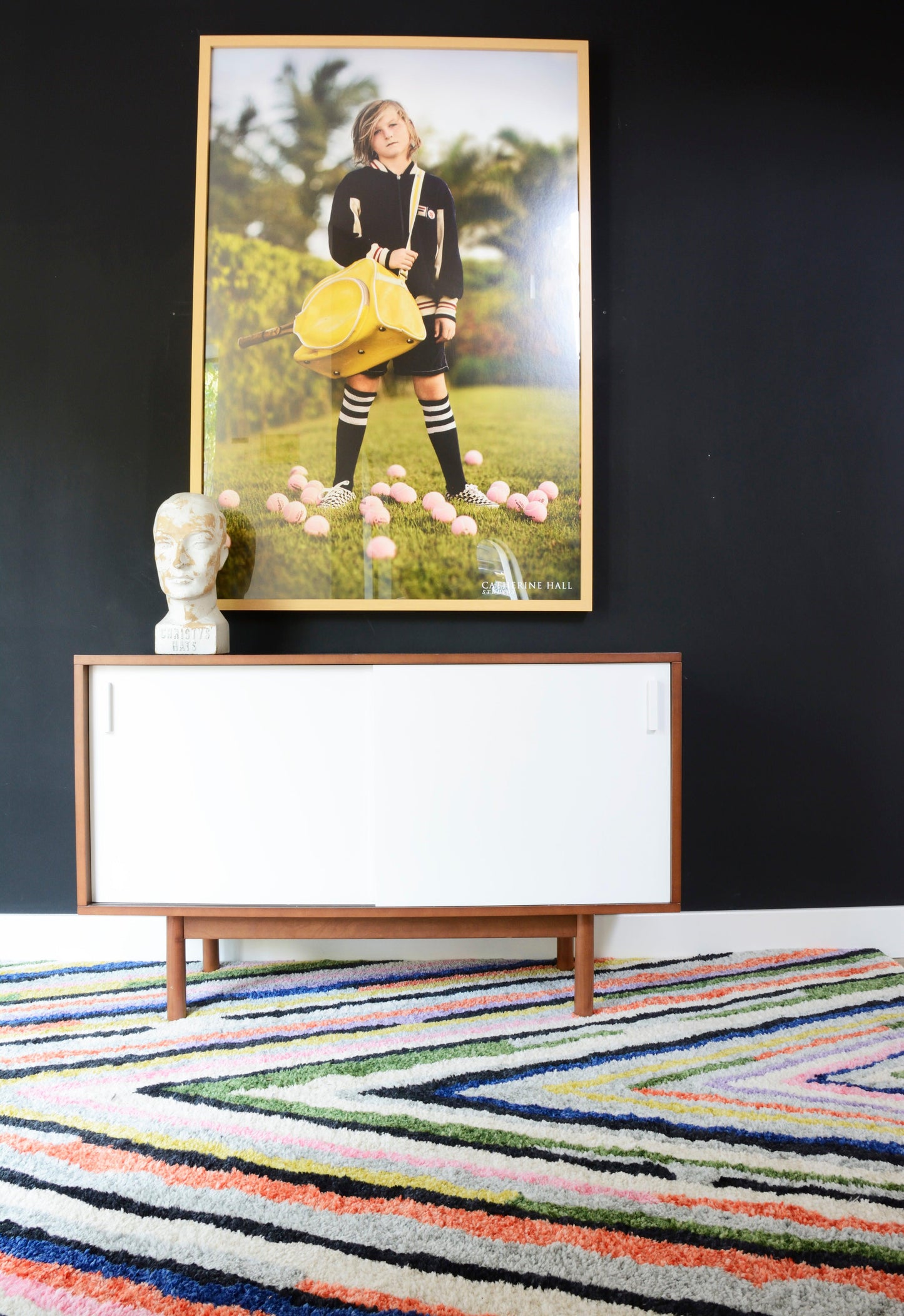 9' x 12' area rug on the floor with a patterned design.