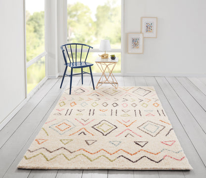 Cream shag rug with pastel geometric diamonds; blue spindle chair beside a copper-legged side table with lamp.