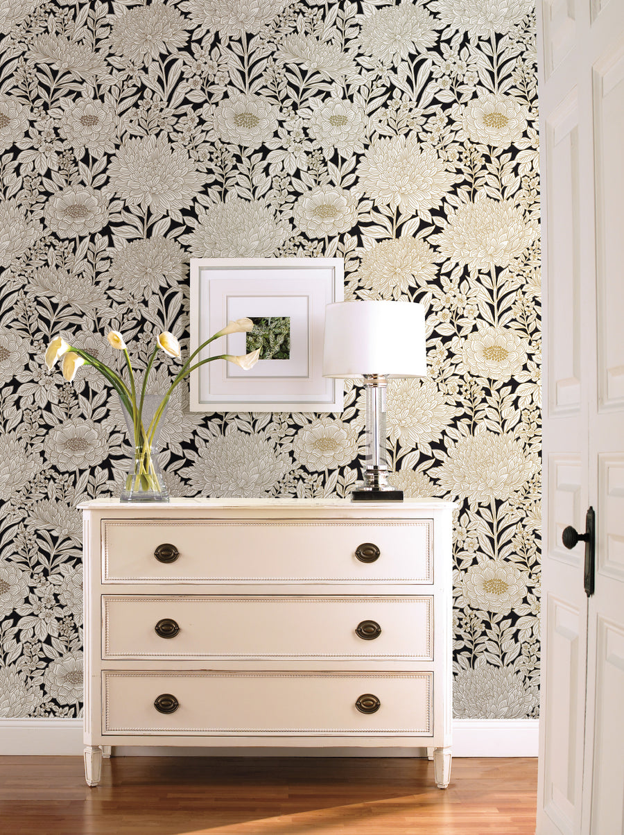 Luxury black and gold botanical wallpaper featuring oversized floral blooms and detailed foliage on a dramatic dark background, creating a sophisticated statement wall for glamorous and elegant interiors.