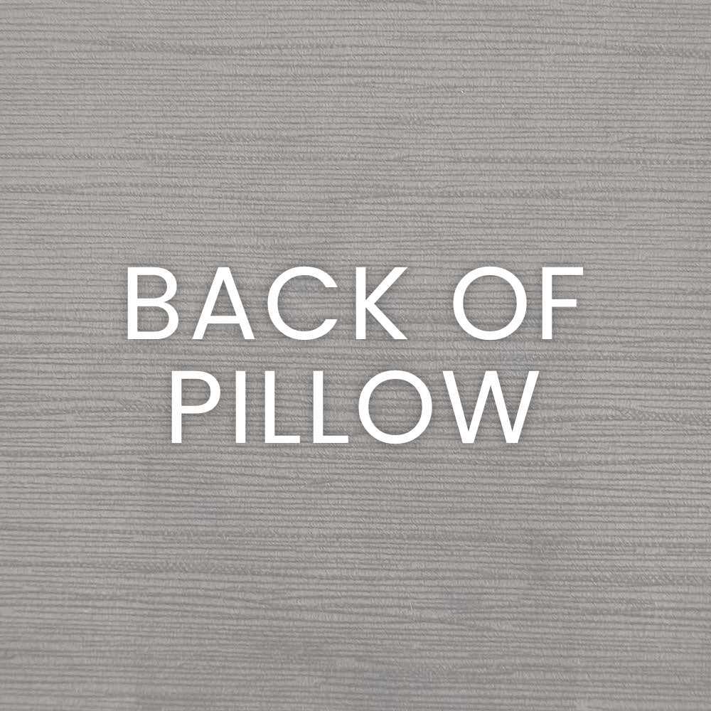 Gray wood-textured backdrop with bold white 'BACK OF PILLOW' lettering.