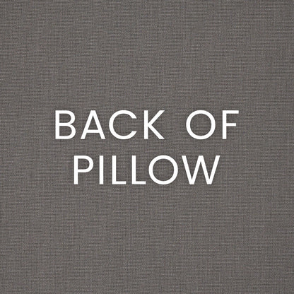 Outdoor 12" x 24" lumbar pillow with a black floral daisy chain pattern; gray woven back fabric texture visible.