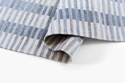 Woven blue and beige striped runner rug, soft textured fabric, 2' x 8'.