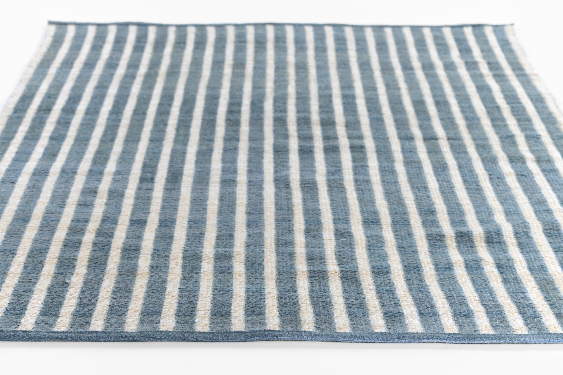Blue and white striped flat-weave runner rug