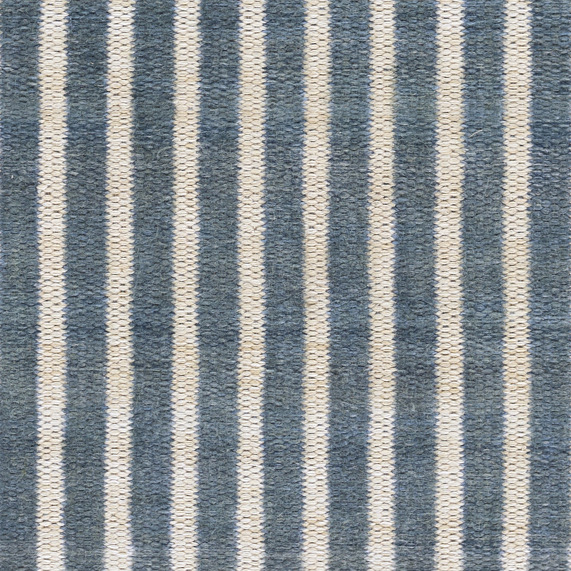 Blue and ivory striped textured woven runner rug with vertical bands, casual coastal style for living room.
