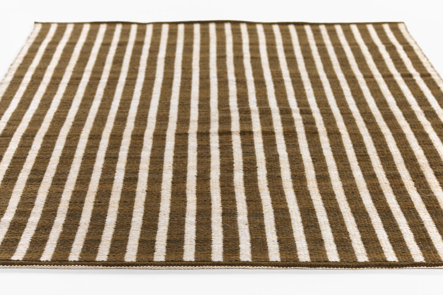 Brown & white striped rug, rectangular flat-weave with bold vertical stripes, modern coastal style.