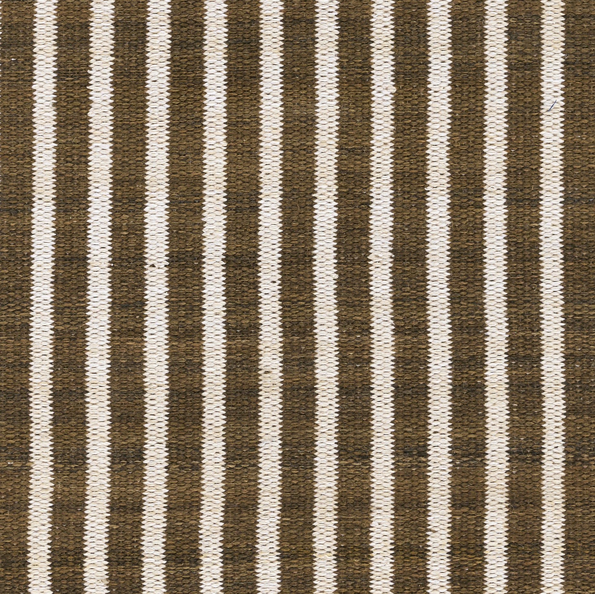 Natural-fiber woven rectangular rug with dark brown and cream vertical stripes; rustic, versatile floor decor.
