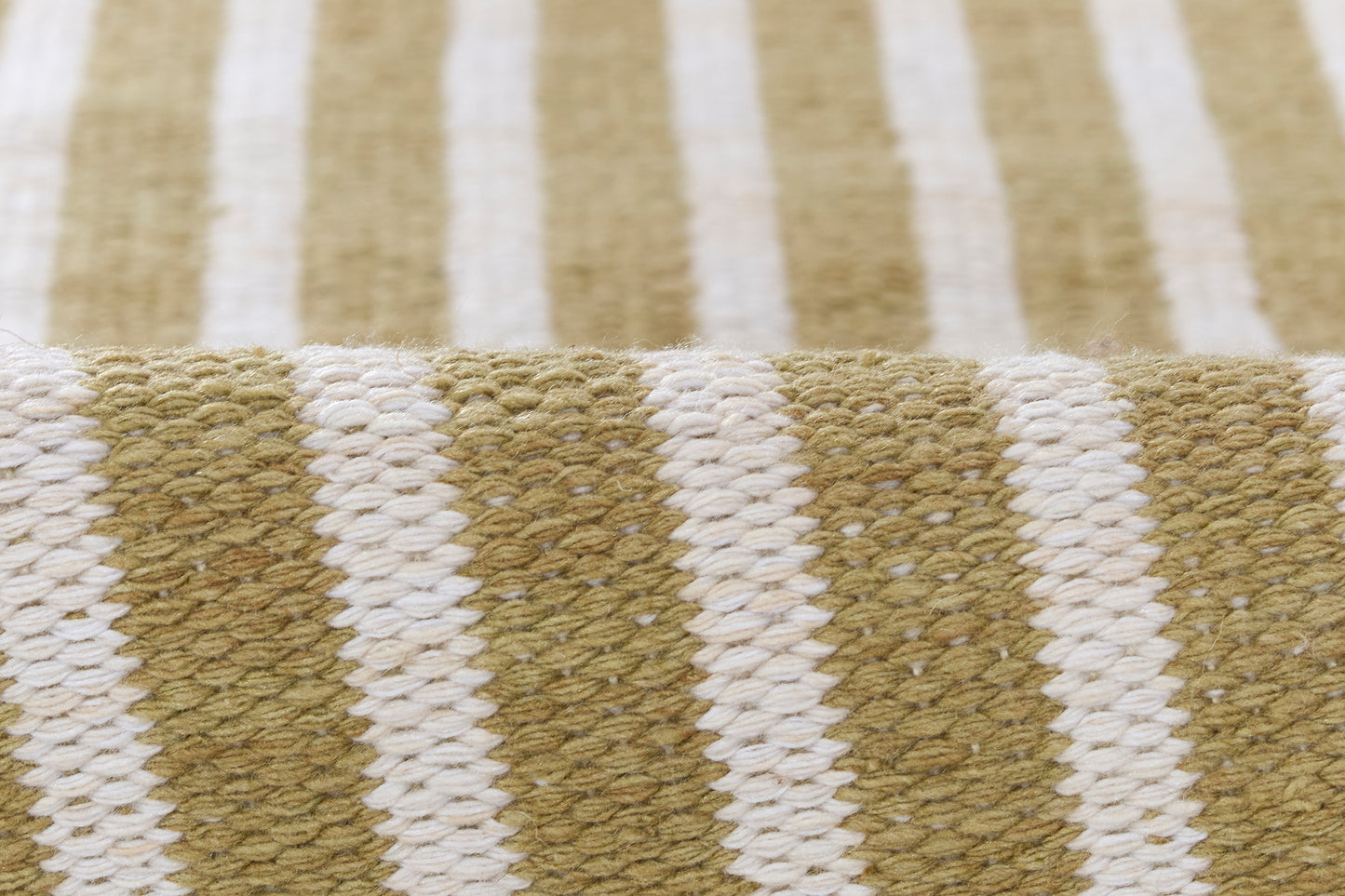 Close-up of khaki and white striped woven textile with chunky braided yarn.