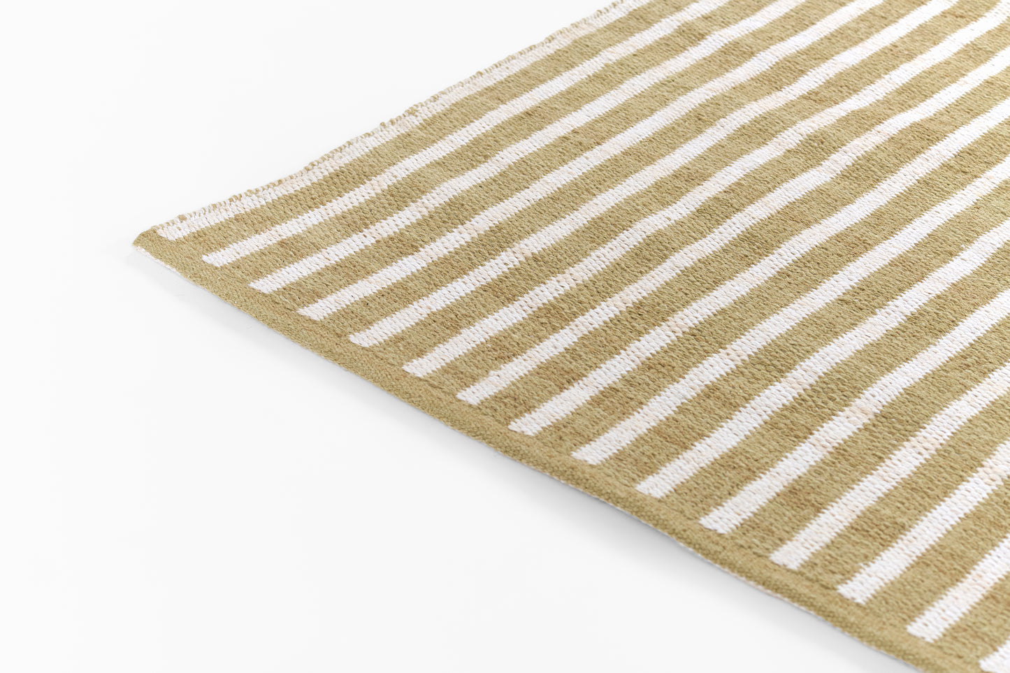 Beige & white striped woven rug with fringed edges; natural fiber, rectangular, casual coastal style.