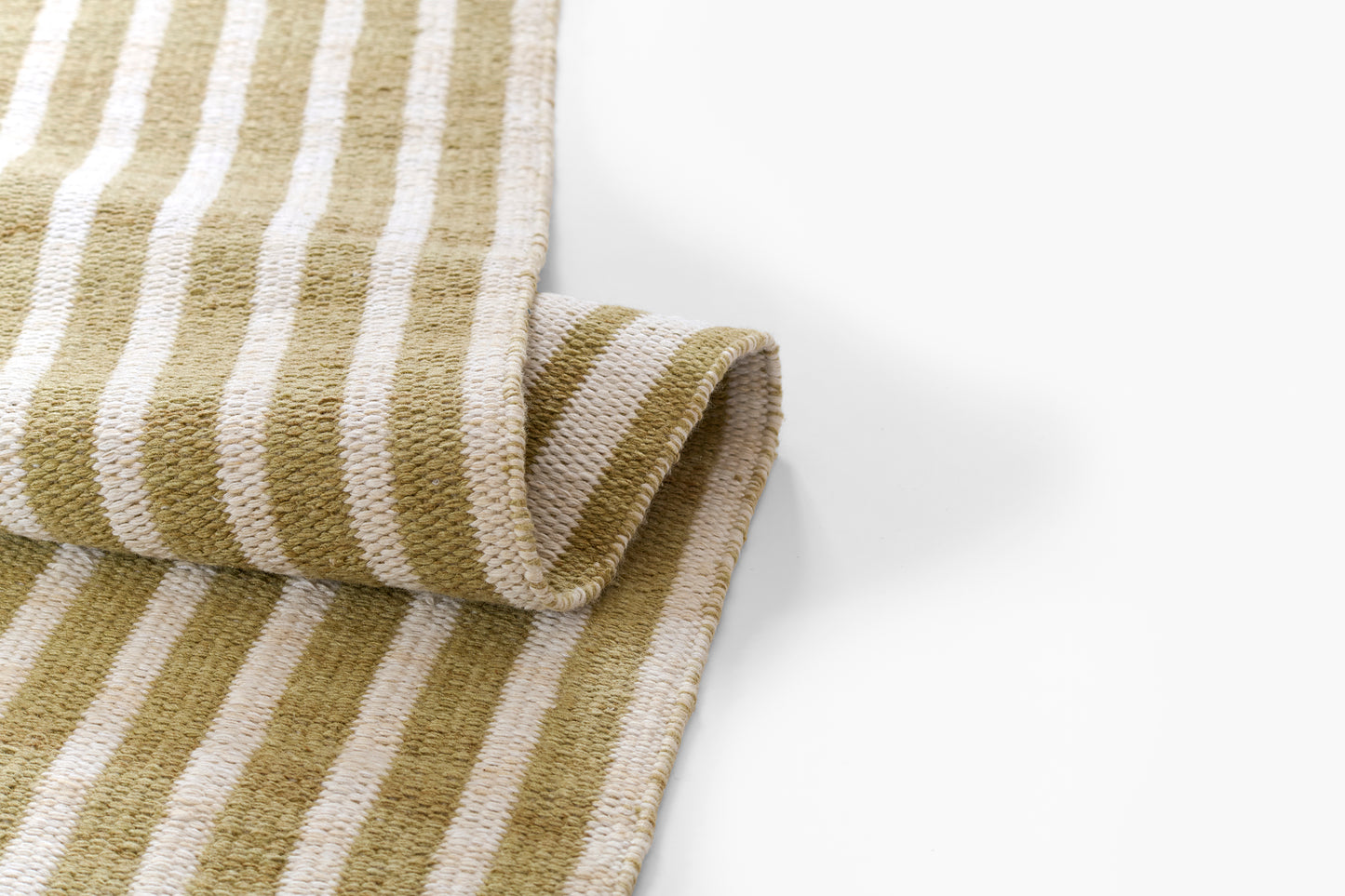 Khaki and cream striped woven cotton rug with rolled edge, rustic style.