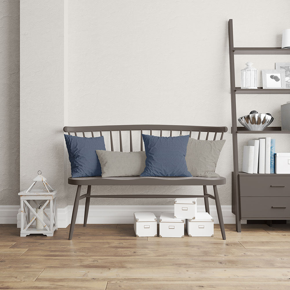 Indigo herringbone fabric upholstery visible in a living room setting with shelving and white storage boxes.