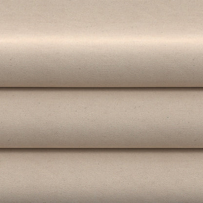 Beige cotton canvas fabric folded into wide layers; plain weave, neutral utility style.
