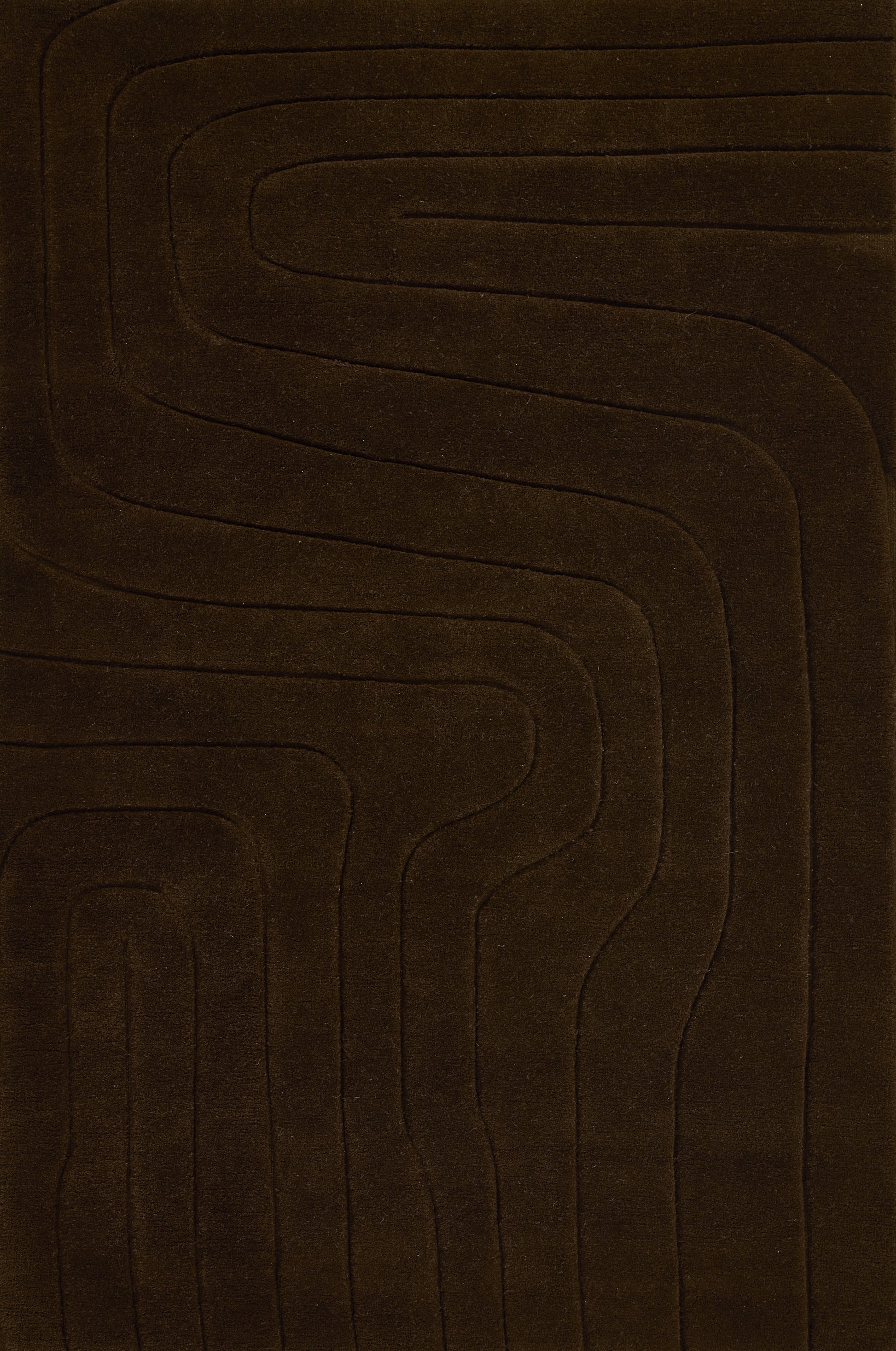Brown area rug with embossed concentric rectangular channels, soft plush texture, modern geometric style.