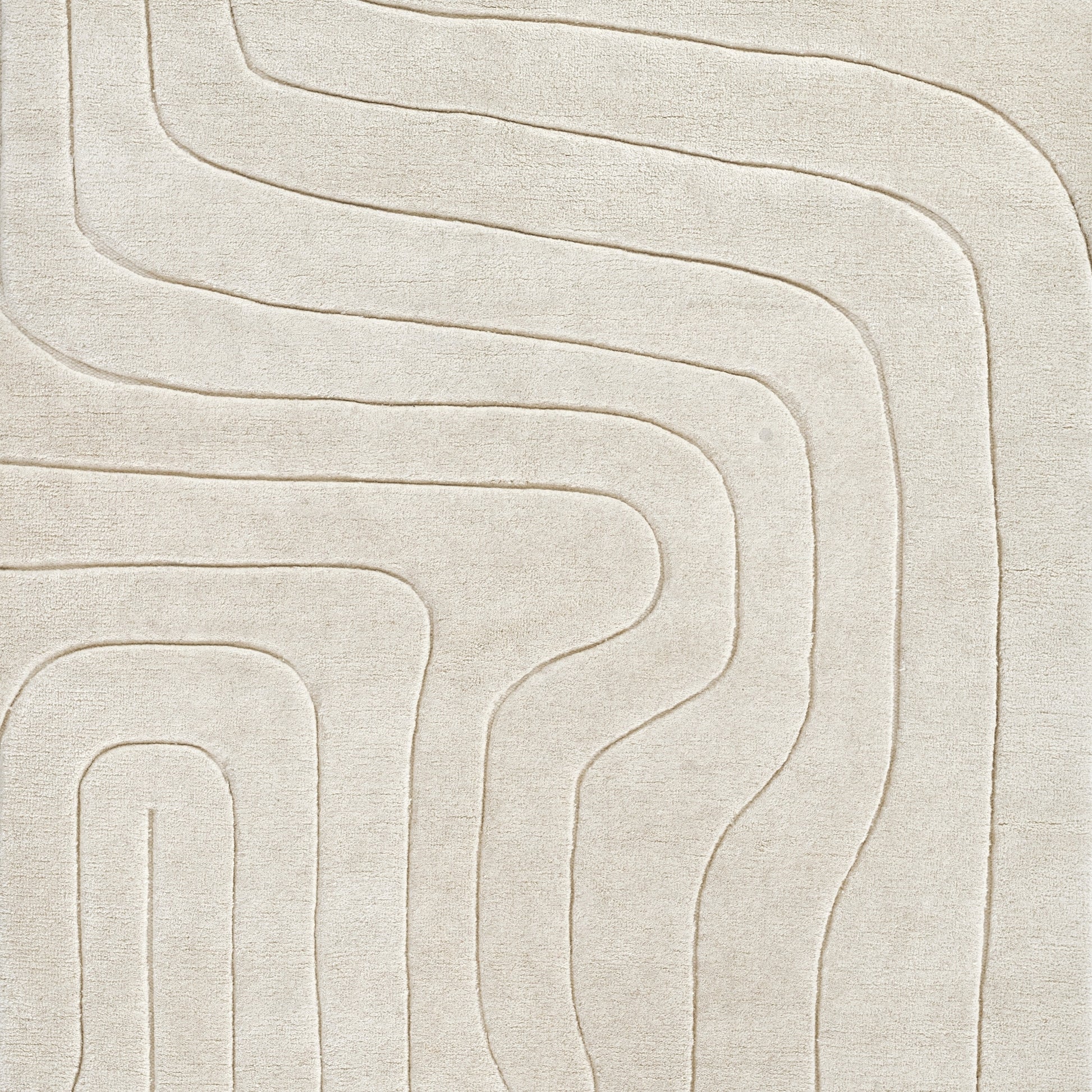 Beige textured area rug with raised curvilinear maze pattern; modern, neutral decor for living spaces.