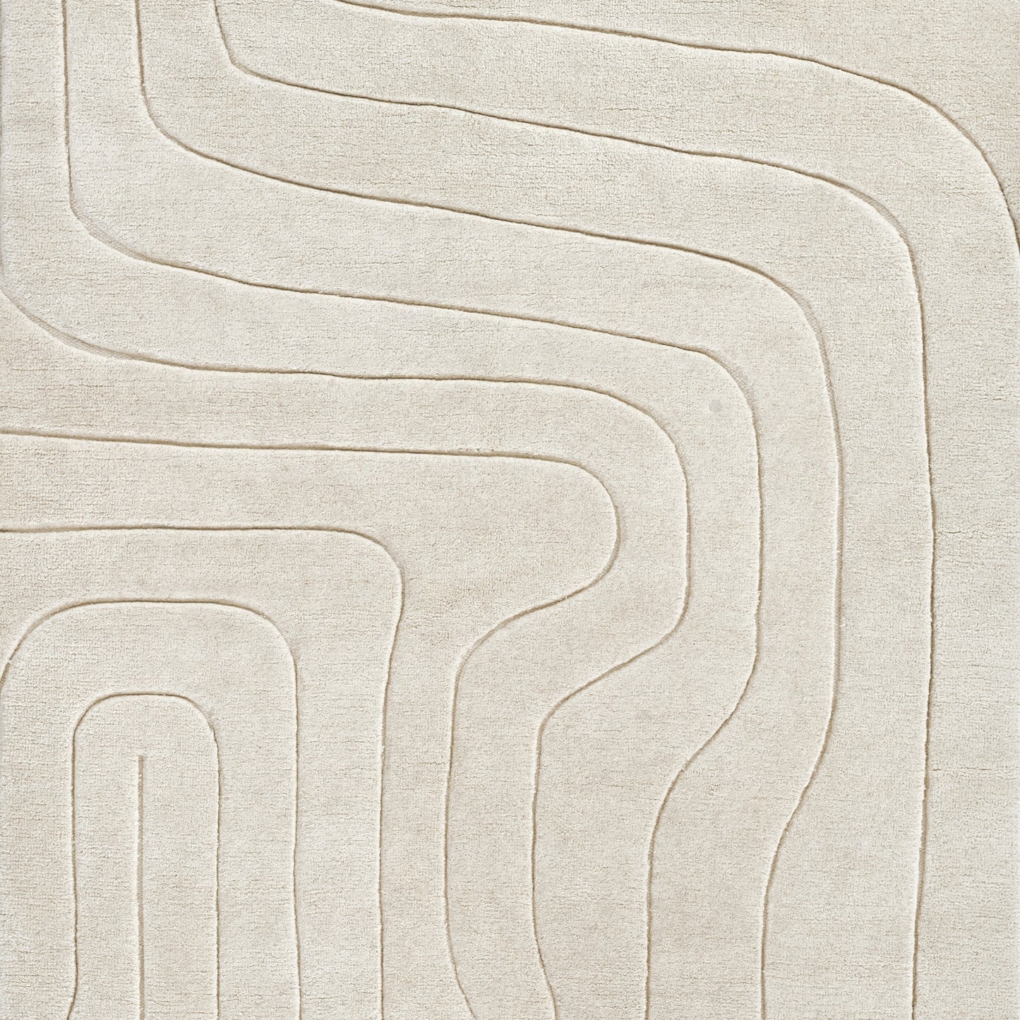 Beige textured rug with raised, curving labyrinth lines in a modern abstract pattern.