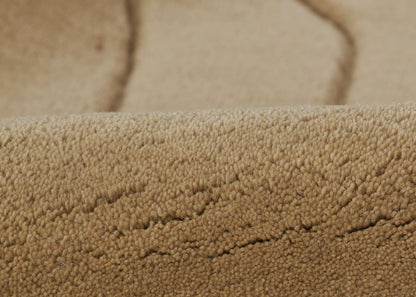 Beige sherpa fleece fabric close-up with fluffy plush pile and warm cozy texture.