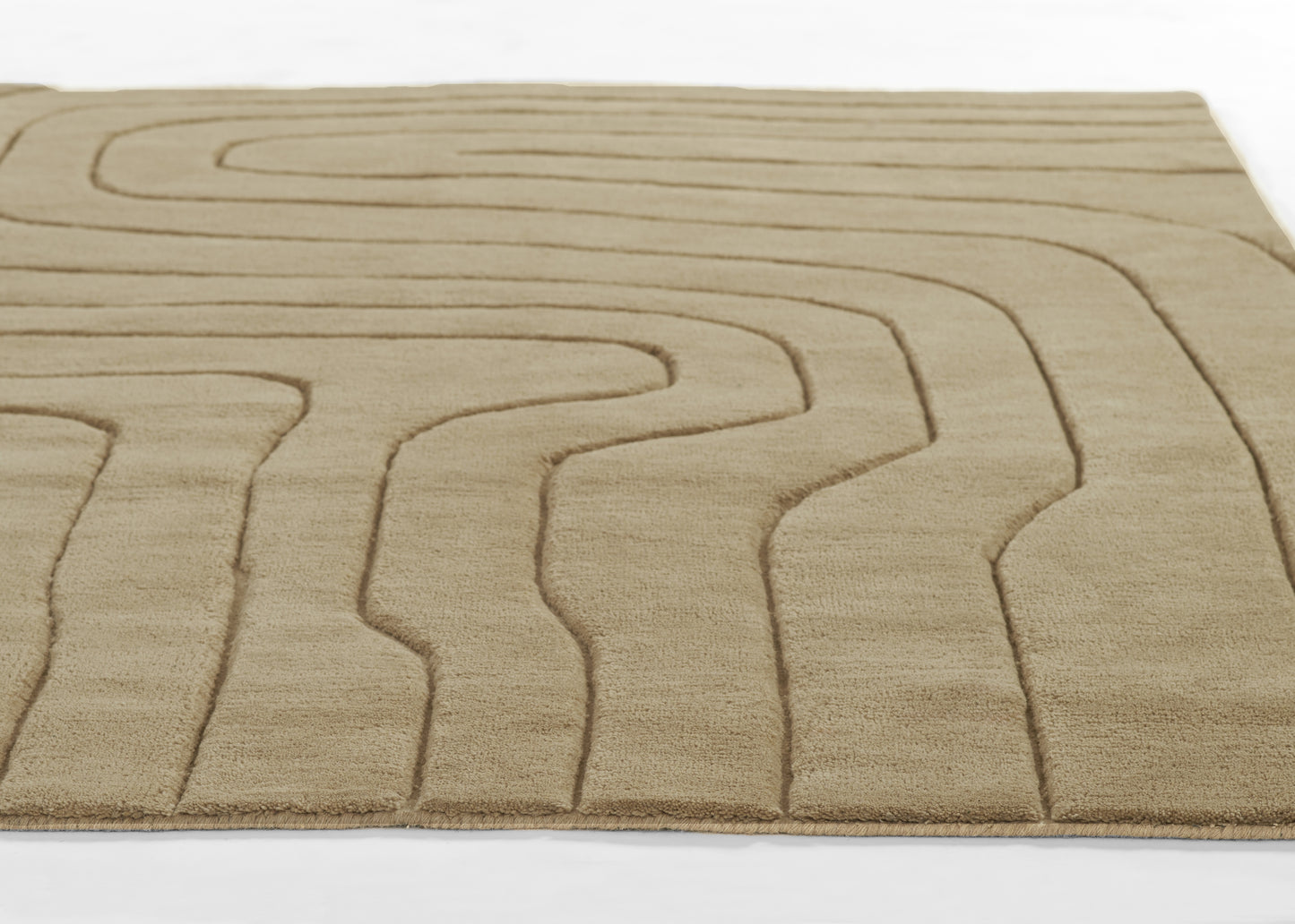 Beige tufted rug with raised abstract wavy channel lines, rectangular shape, soft plush texture for modern interiors.