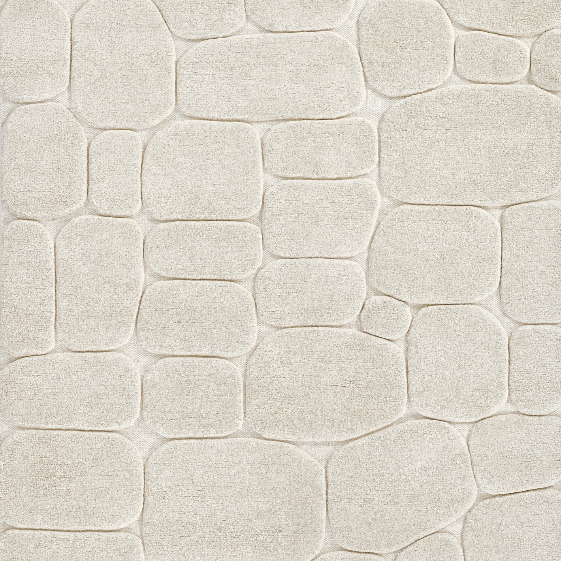 Cream beige pebble-stone texture with rounded rectangular shapes and subtle grout; decorative wall tile pattern.