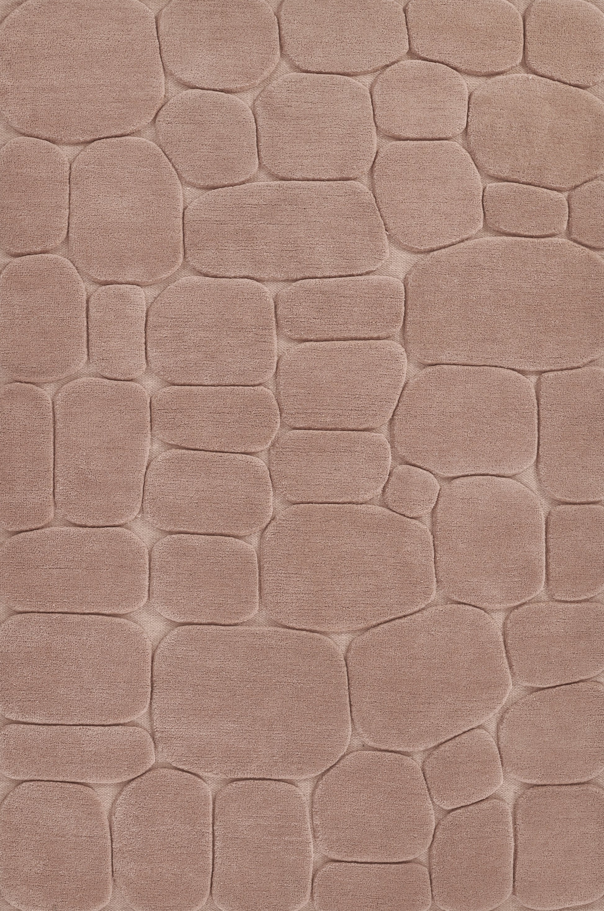 Dusty pink plush area rug with raised cobblestone-like shapes for cozy, modern decor.