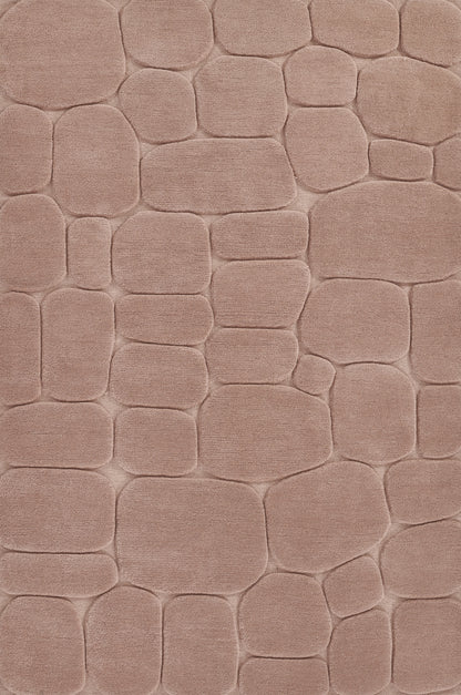 Dusty pink plush area rug with raised cobblestone-like shapes for cozy, modern decor.