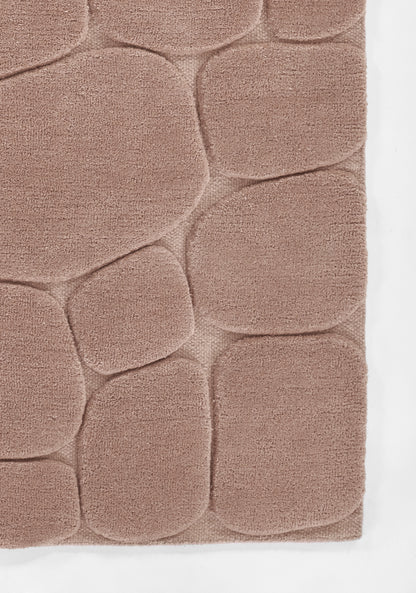 Dusty-rose pebble-pattern shag rug with soft microfiber piles and rounded stone shapes.