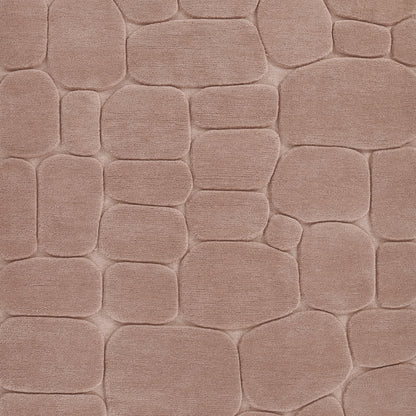 Soft pink textured fabric with rounded cobblestone block pattern, plush upholstery or rug style.