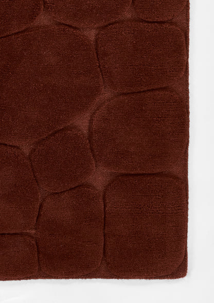 Dark rust-brown plush microfiber rug with quilted pebble pattern and rounded square panels, 8' x 10'.