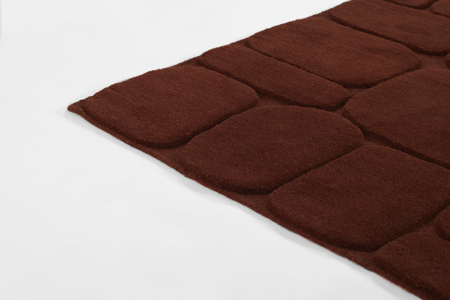 Deep brown plush tufted rug with square padded panels, soft shag texture, rectangular shape for living room decor.