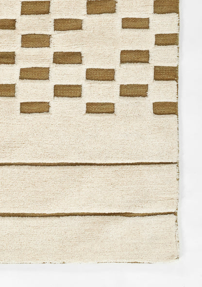 Beige shag rug with brown rectangular blocks in a stepped grid; soft textured pile.
