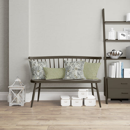 Floral botanical fabric in grey and sage tones, shown in a neutral living room setting.