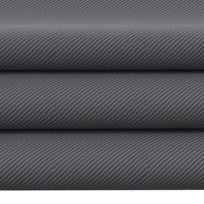 Gray novelty fabric rolls stacked, close-up diagonal weave.