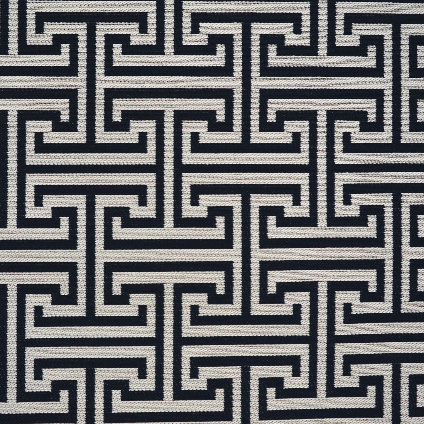 Navy & ivory woven fabric with Greek key meander pattern; upholstery or drapery textile.