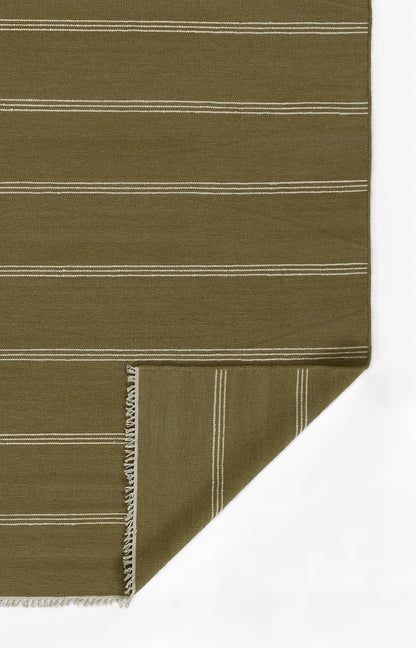 Olive green woven rug with white horizontal stripes and fringe, folded at the corner.