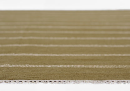 Olive-green flatweave rug with white striped bands and white fringe along the edge.