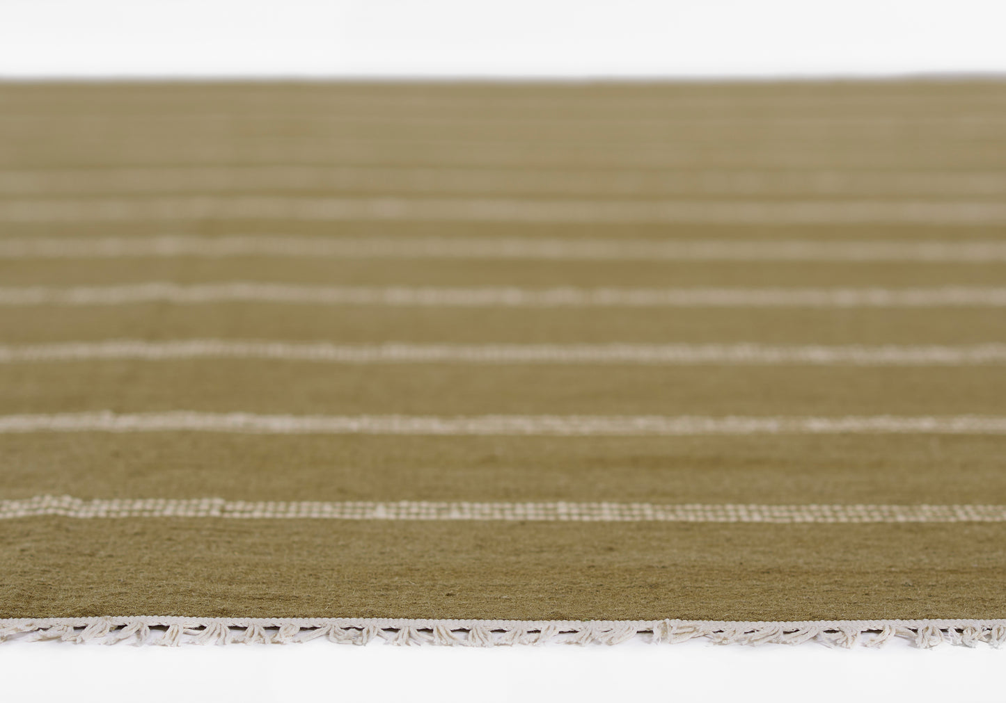 Olive-green rug with white horizontal stripes and tassel fringe along the edge.