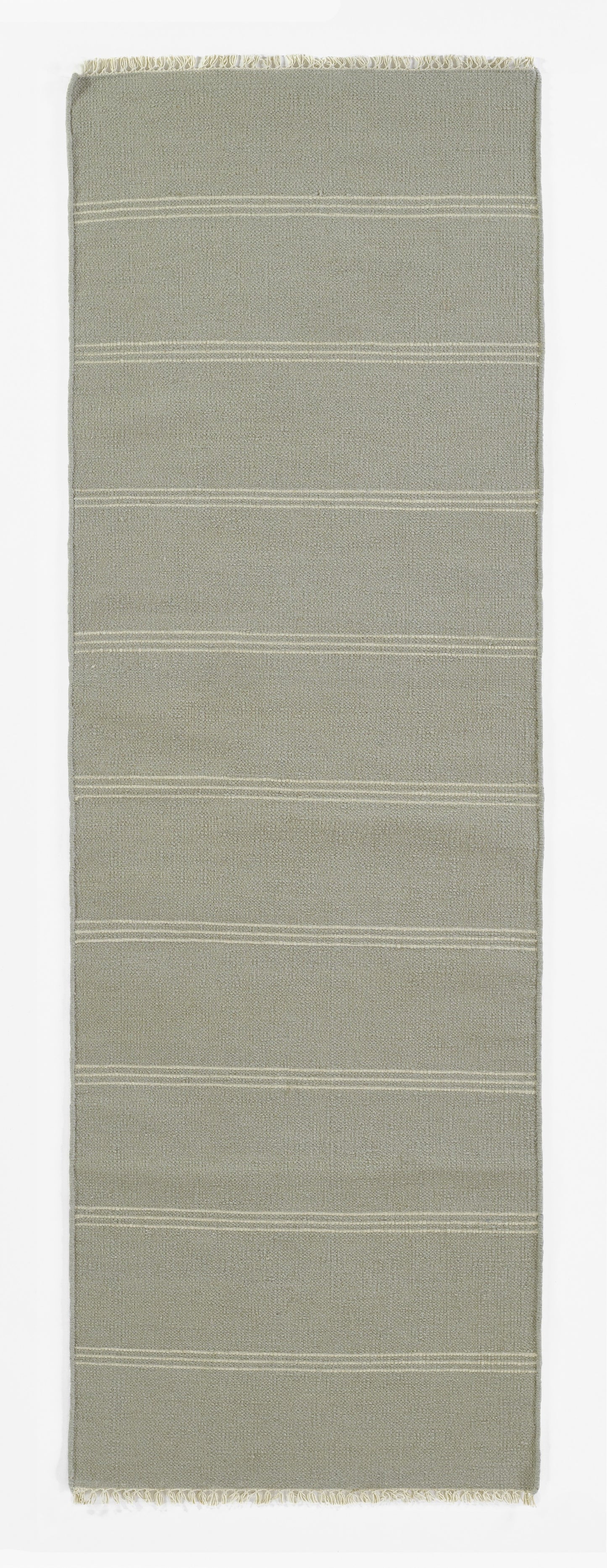 Beige-gray woven rug runner with subtle horizontal white stripes and fringed ends.