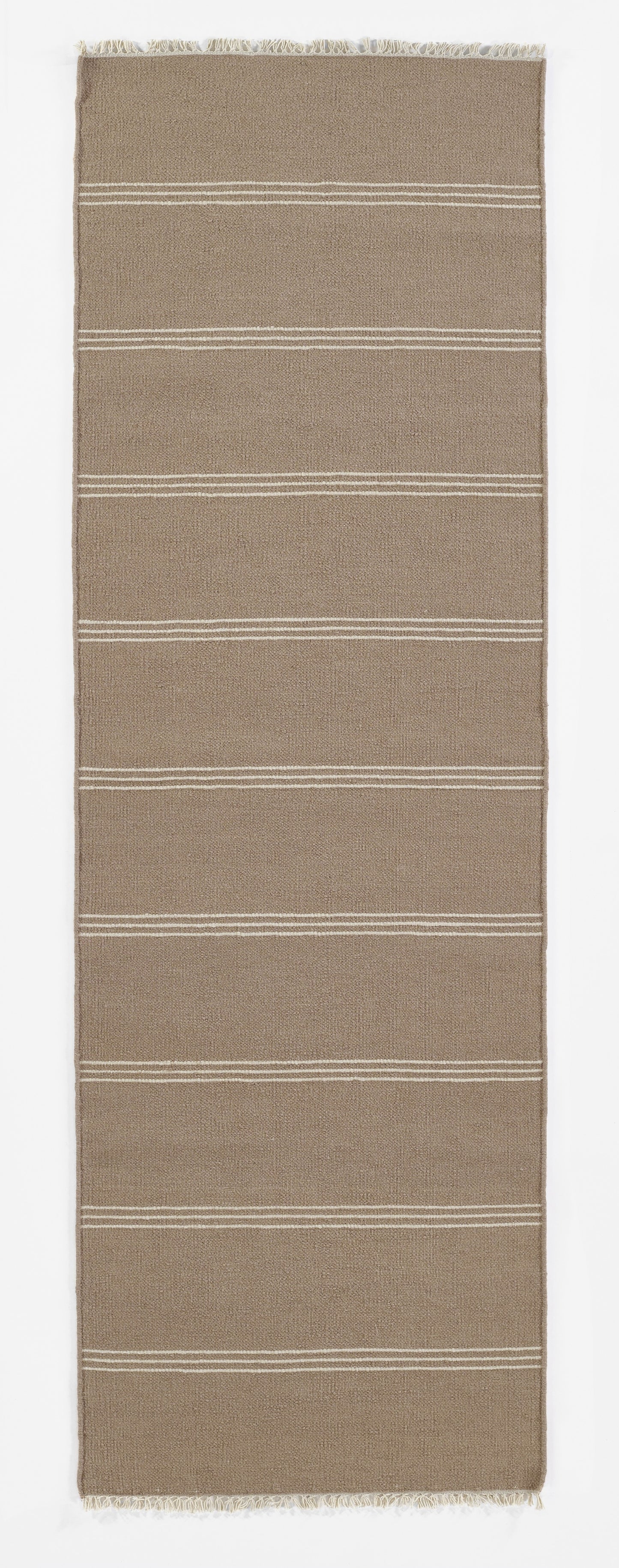 Taupe woven rug runner with horizontal white stripe bands and fringed ends.