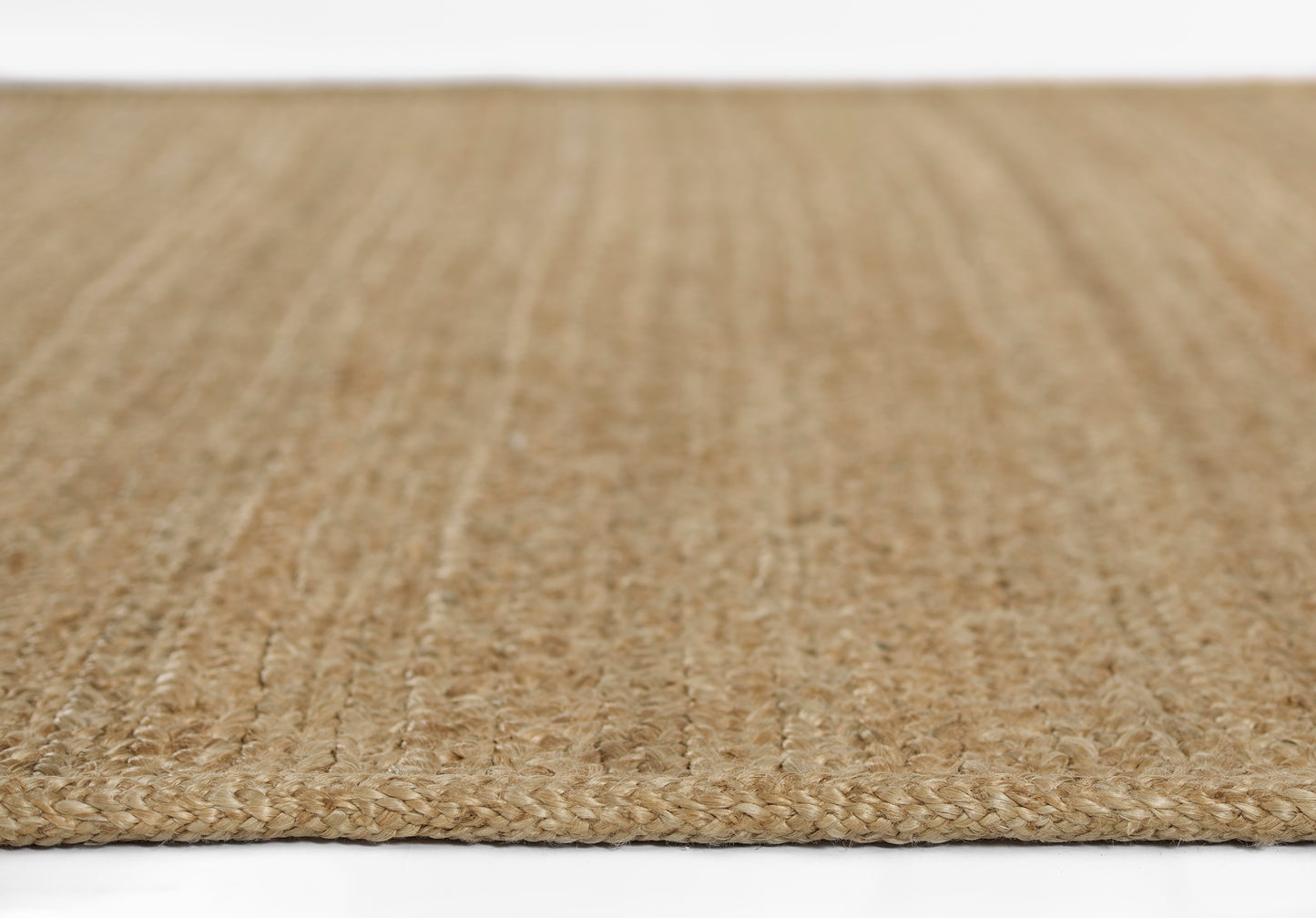Natural beige jute runner with braided texture; 2'6" x 8'; rectangular, rustic style.