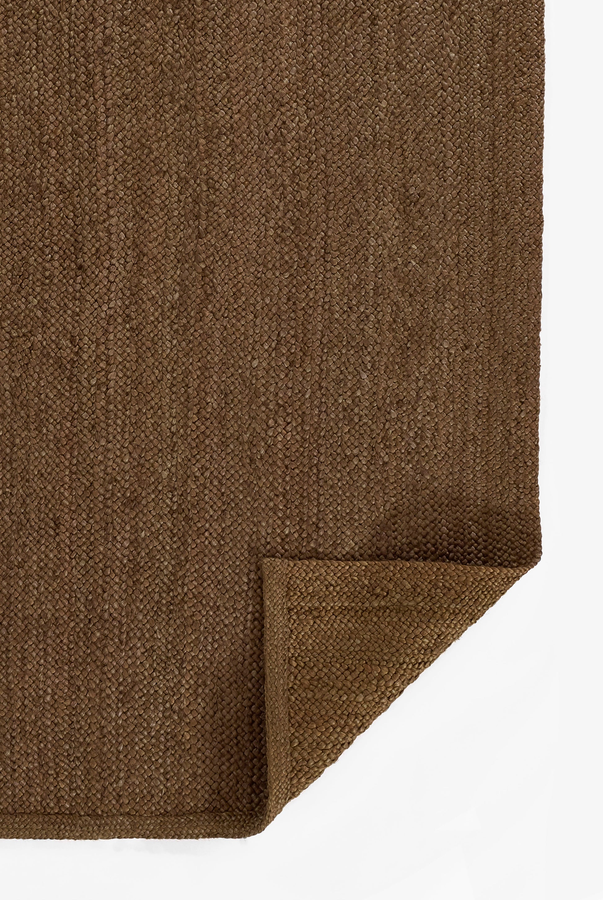 Brown textured loop-pile rug with dense weave; folded corner detail.
