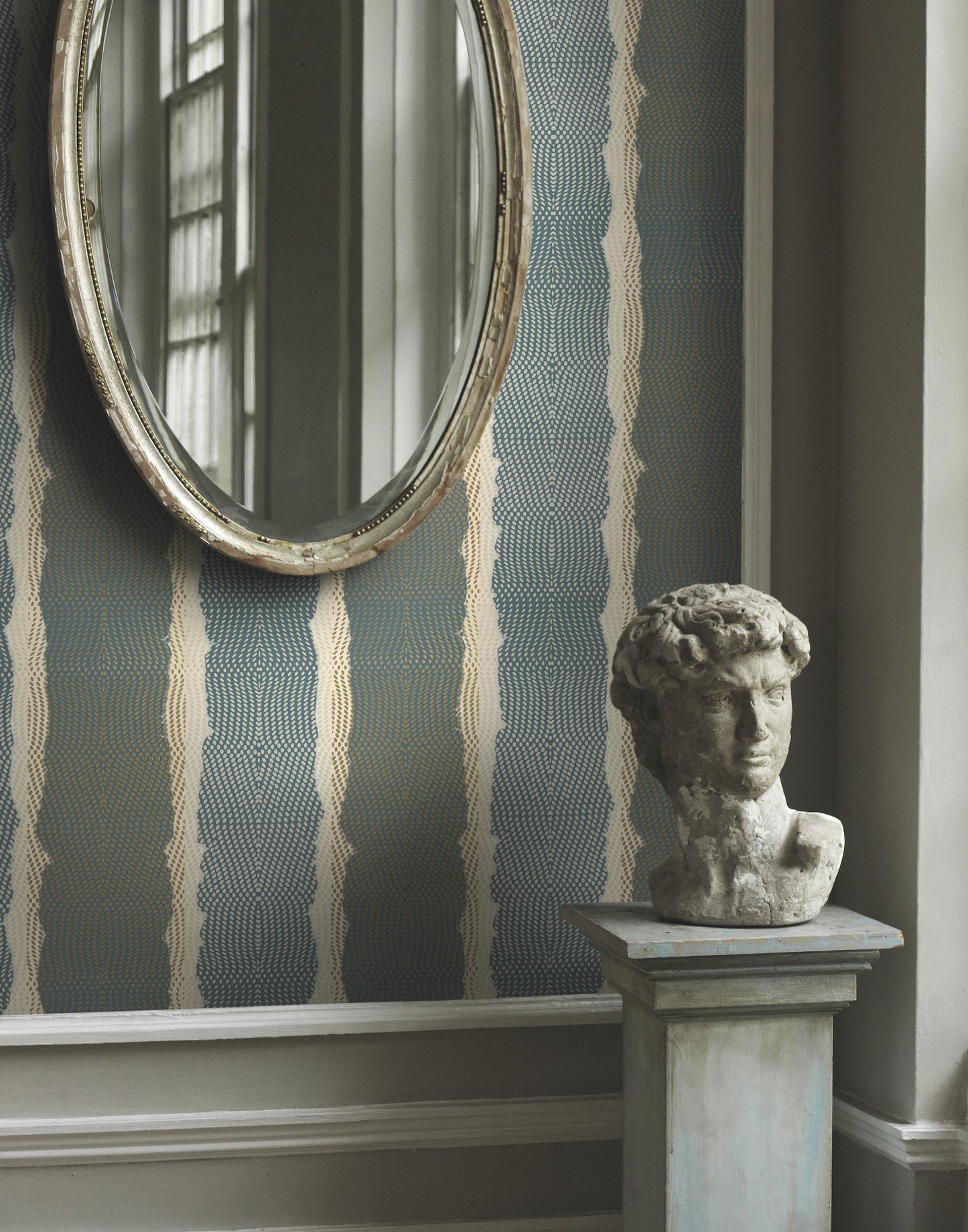 York Lemieux et Cie CE3961 Indigenous teal stripe wallpaper on feature wall, styled with brass accents and cream furnishing — luxury teal striped wallcovering for modern and eclectic interiors.
