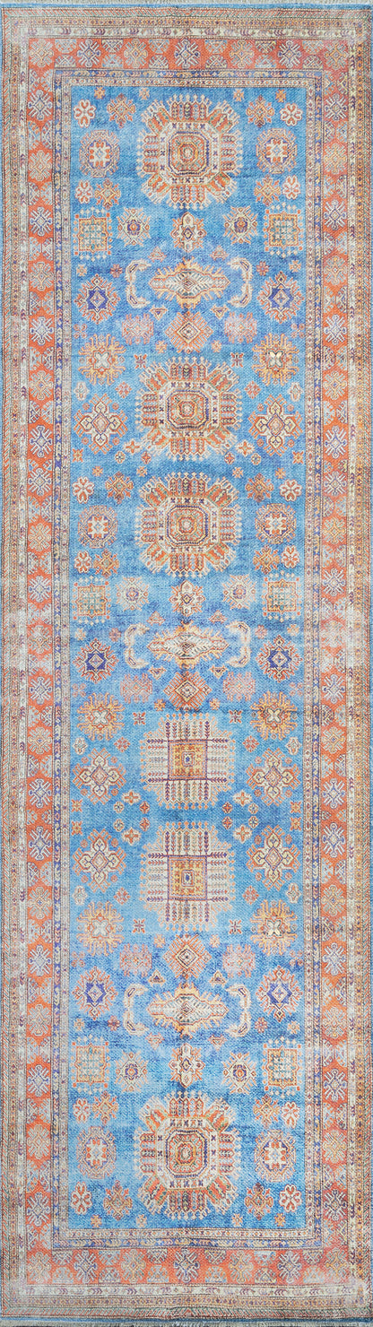Blue oriental rug with orange border, cream accents, and geometric medallions; rectangular decorative floor covering.