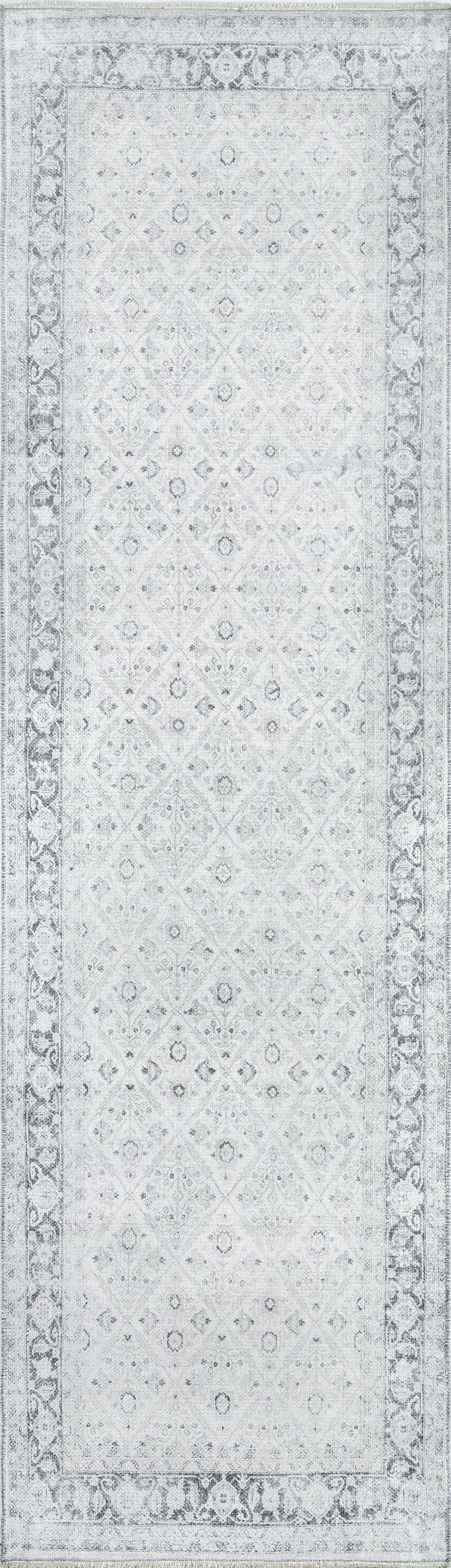 Light gray oriental rug with a faint diamond floral pattern and decorative border.
