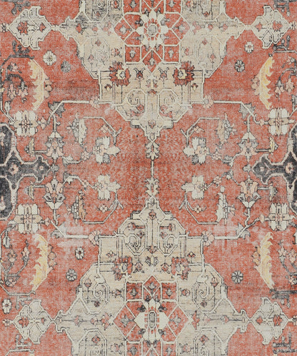 Distressed oriental rug with ivory geometric medallions on a rusty red field and floral lattice.