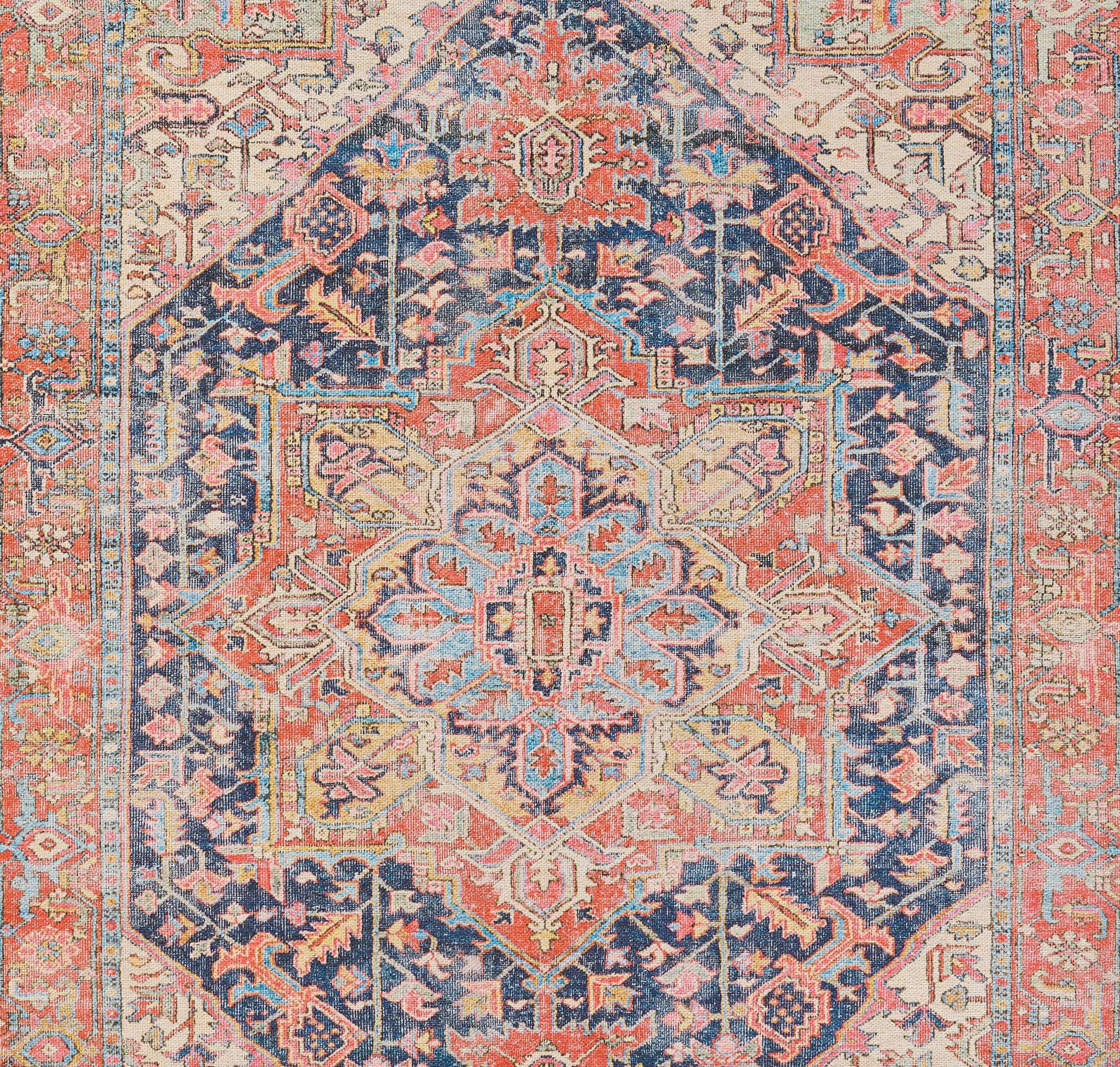 Rectangular Persian-style oriental rug with central medallion, navy, coral, ivory and sky blue, intricate floral border.
