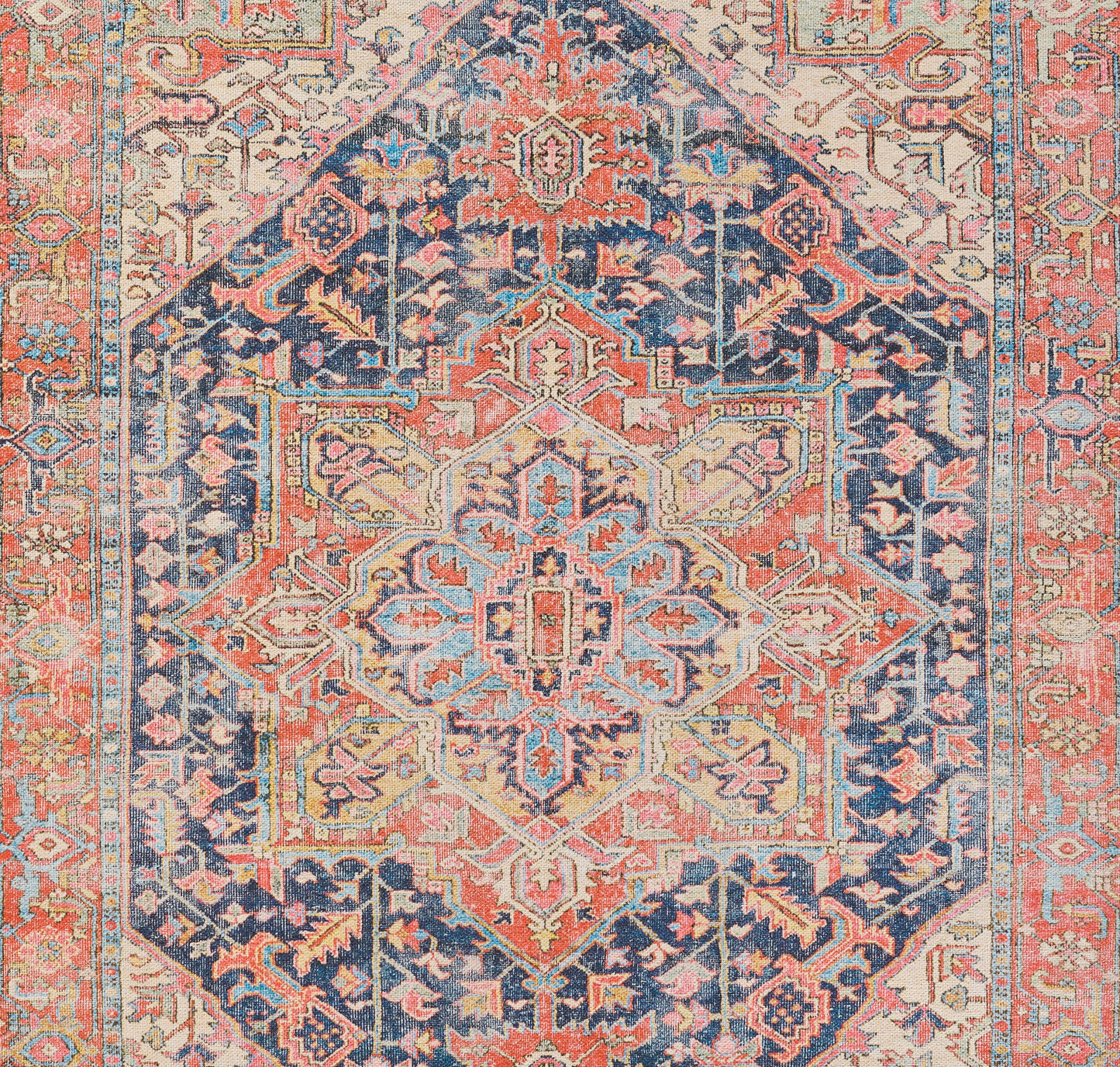 Oriental rug with a pale central medallion on a coral/navy field, intricate geometric floral motifs and layered borders.