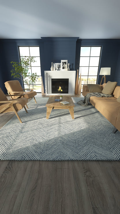 Cozy living room with navy walls, white fireplace, beige sofa and armchairs, wooden coffee table, blue chevron rug.