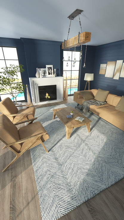 Modern living room with blue walls, beige lounge chairs and sofa, light wood coffee table, chevron rug, white fireplace.