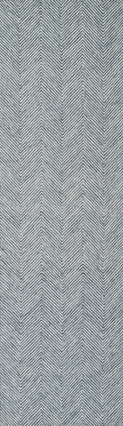 Blue and white chevron-pattern denim-like fabric with diagonal weave.