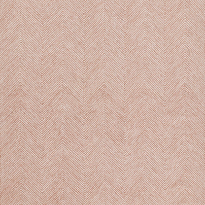Peach pink herringbone chevron fabric texture, soft woven textile ideal for upholstery or apparel.