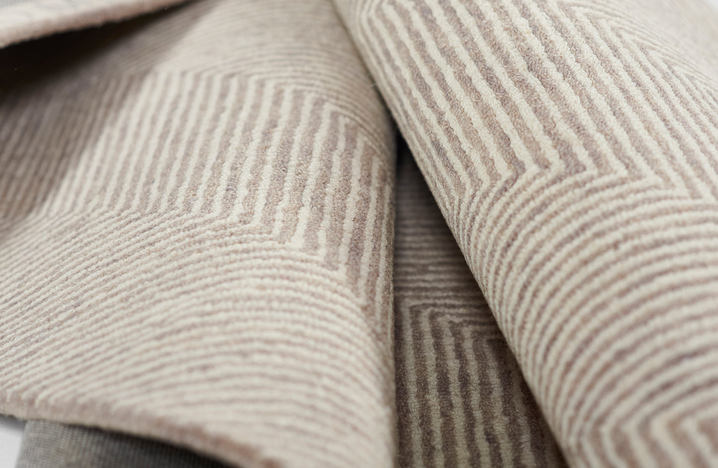 Beige taupe corduroy fabric with soft ribbed wales; versatile texture for jackets or upholstery.
