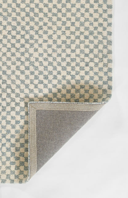 Blue and cream checkerboard woven rug with soft texture; folded corner reveals grey backing and pale blue binding.